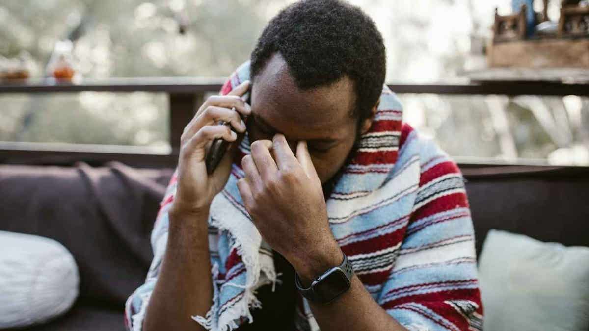 Fake agent phone scams are spreading fast across the US 3 A man receiving a fake scam phone call.