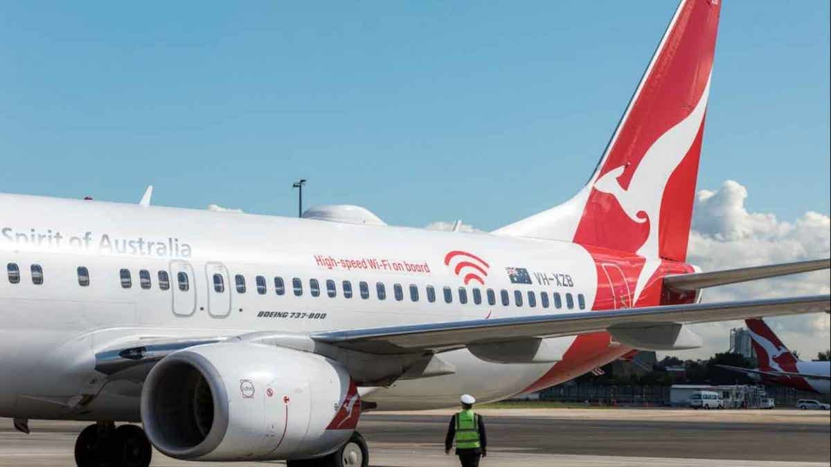 Qantas data breach exposes millions of customer records 4 Qantas aircraft at a gate at an airport.