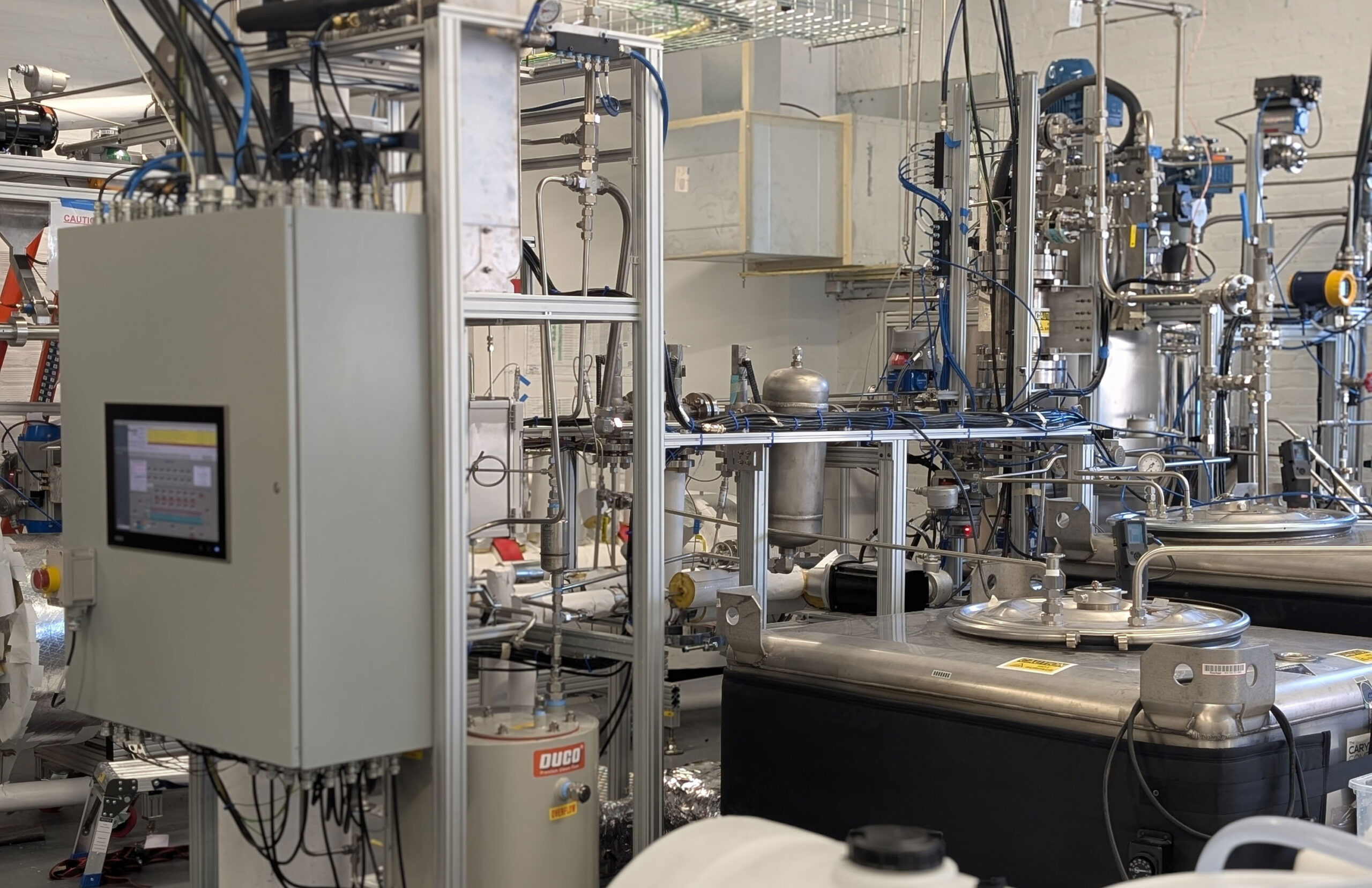 This startup is about to conduct the biggest real-world test of aluminum as a zero-carbon fuel 3 a warehouse view of pipes and gauges of the big engine used to process aluminum