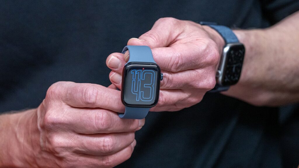 tim cook holding apple watch